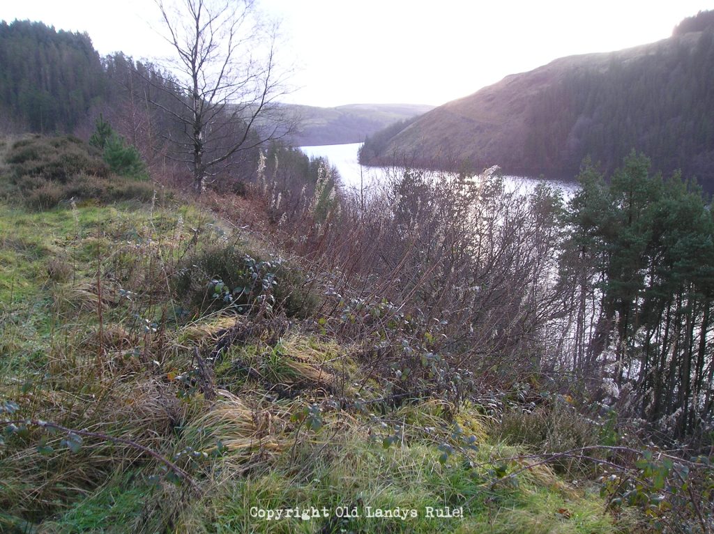 Llyn Bryne Reservoir surrounded by hills