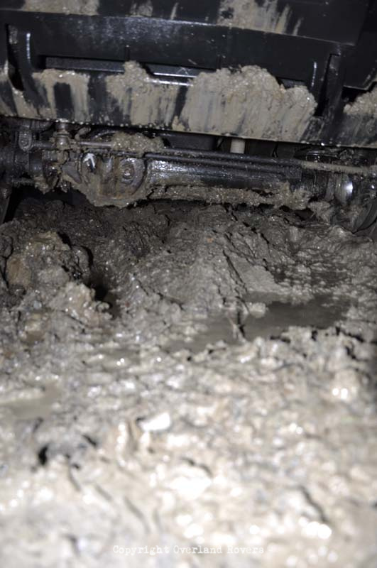 Looking under a Land Rover Discovery 1 at saturated mud and water